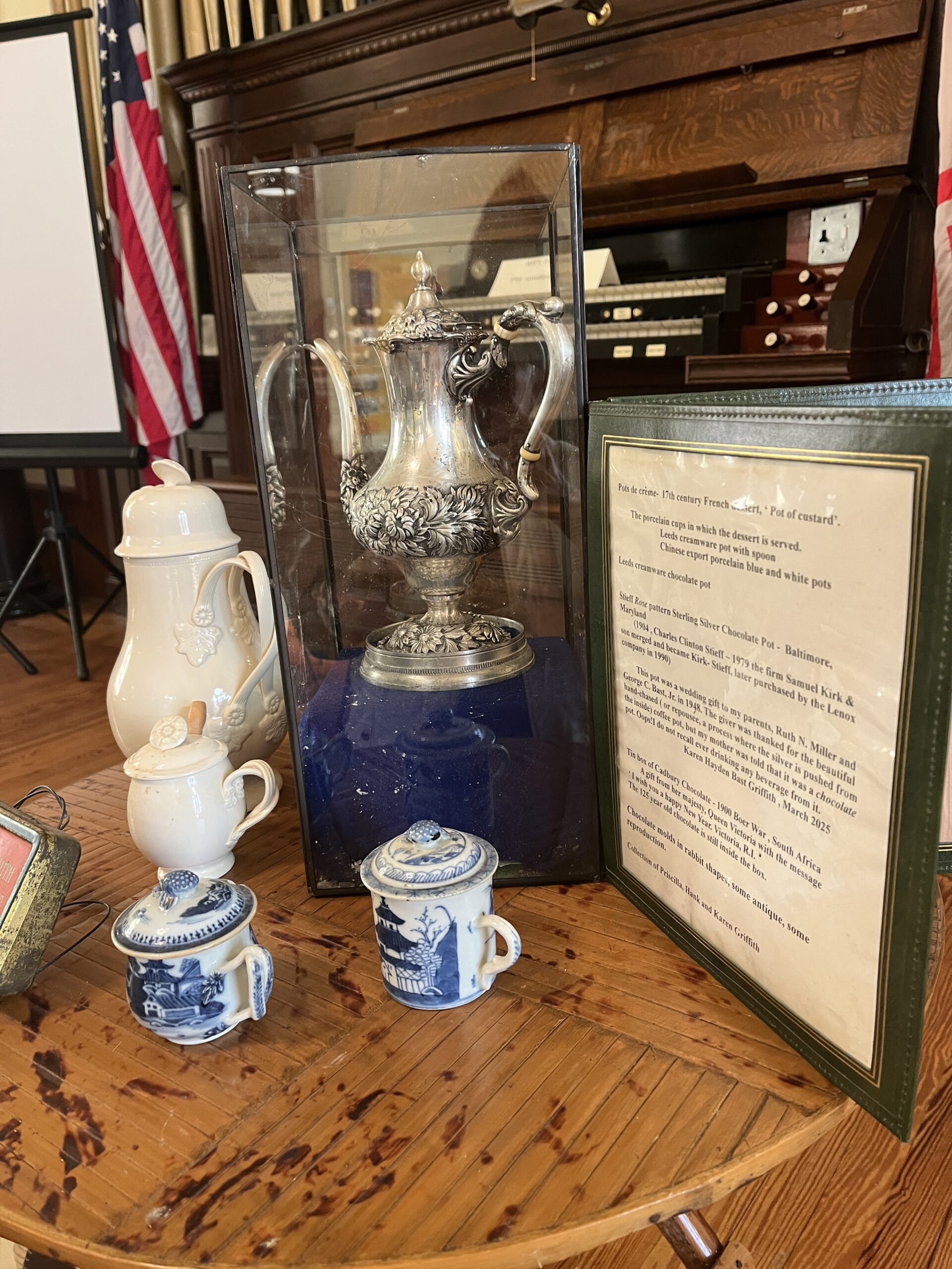 Some antique chocolate pot and serve ware shared by HEC, Inc. board member Karen Griffith. On display at Secrets of the Chocolate Maker Mill Town Tea held March 27, 2025.
